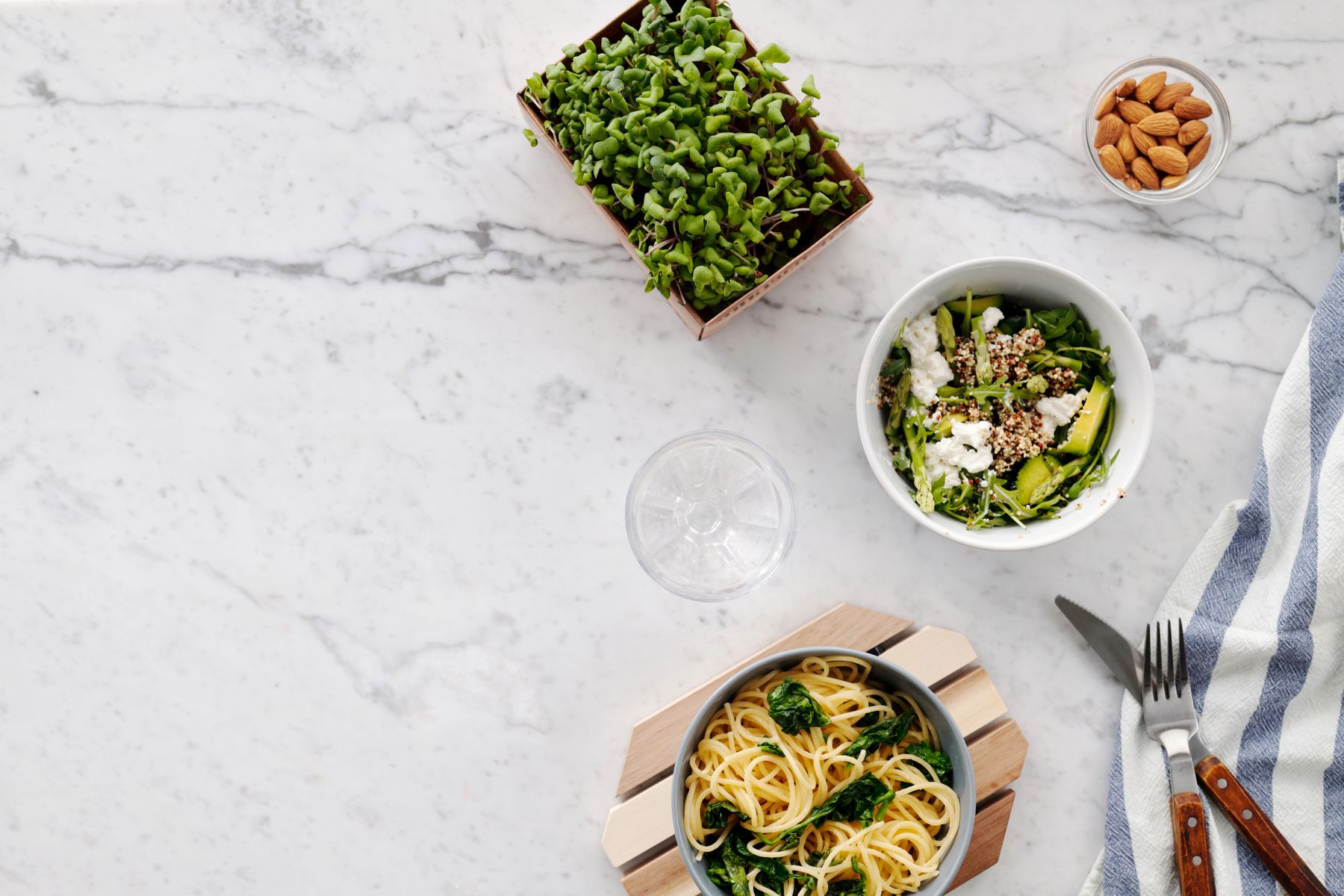 Pasta and salad arranged for a meal